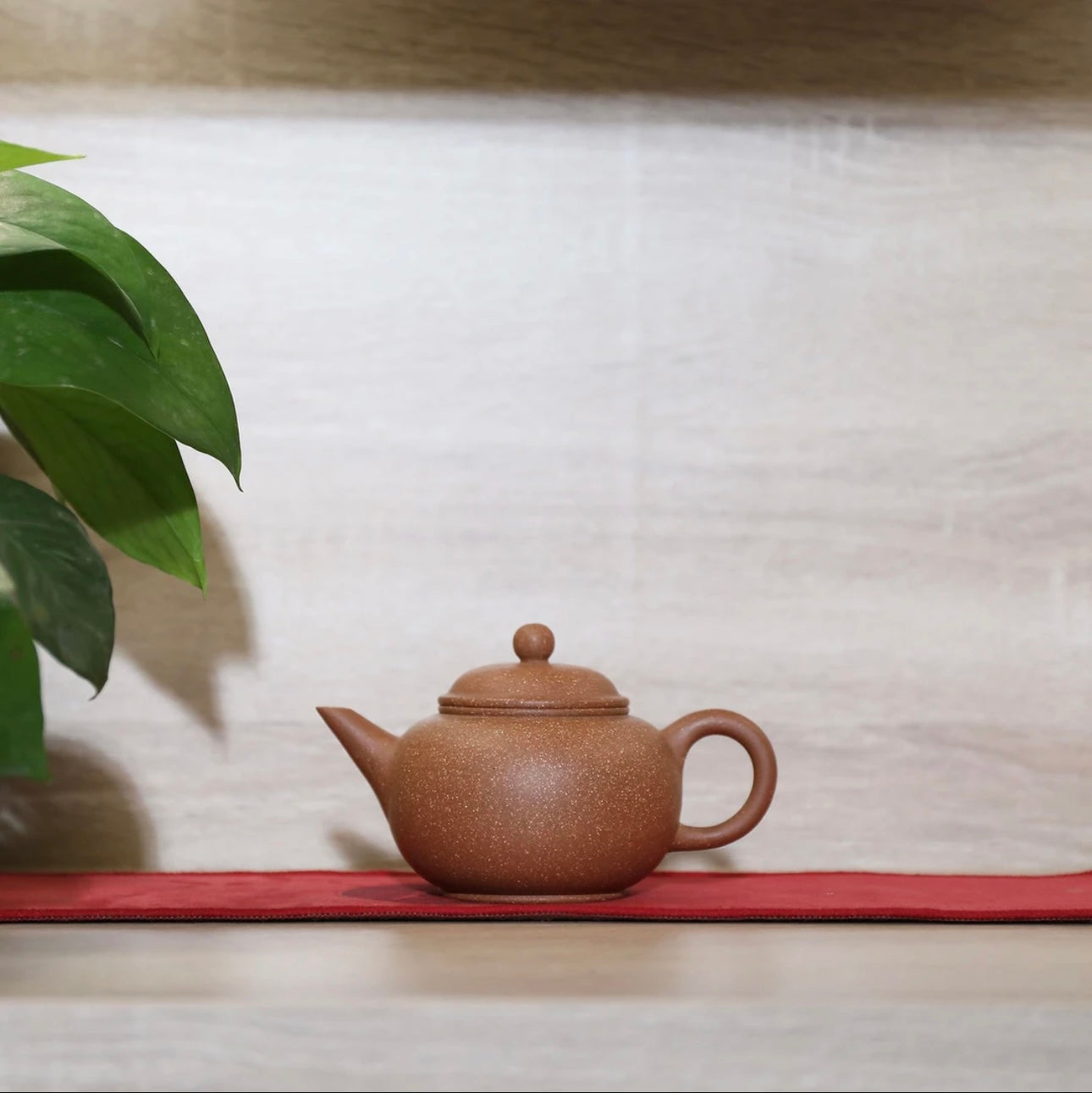 Horizontal purple clay teapot