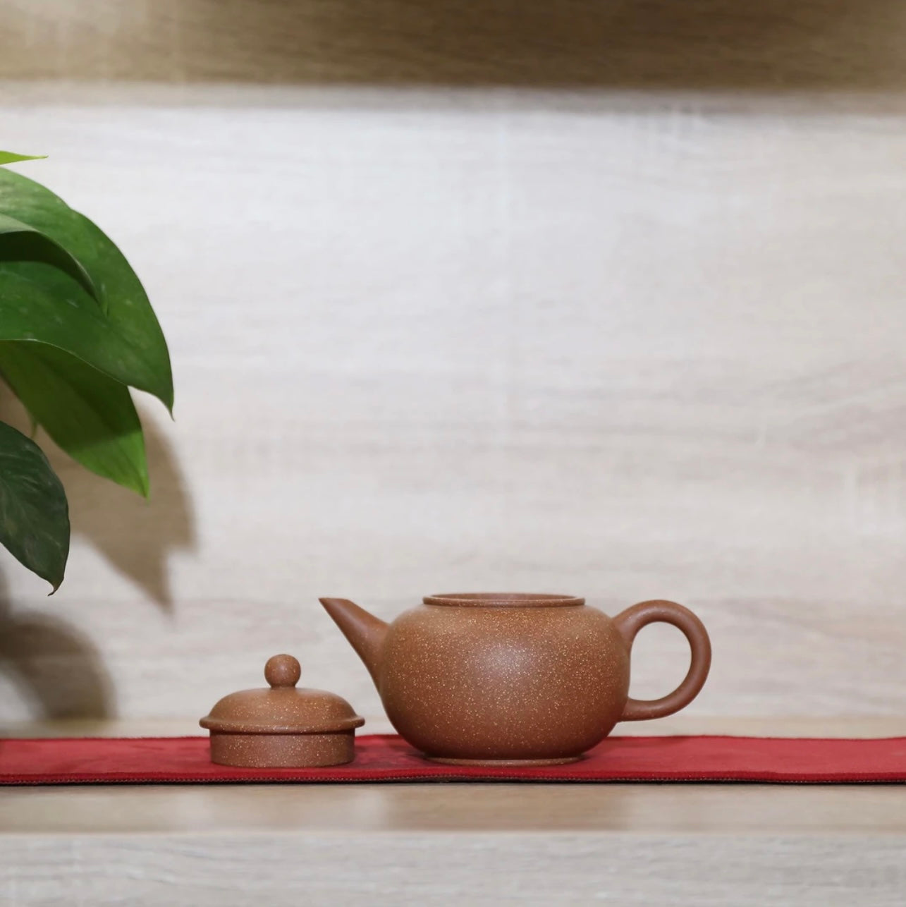 Horizontal purple clay teapot