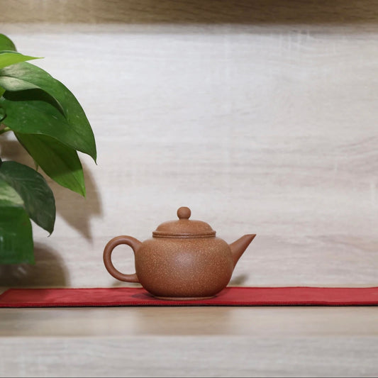 Horizontal purple clay teapot